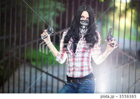 Young woman with guns 3556365