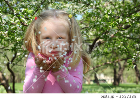 Beauty girl  blowing off petals 3557338