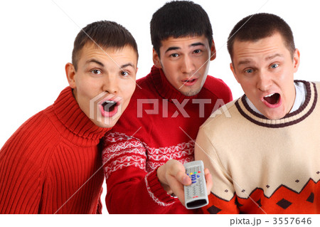Three surprised friends with remote control 3557646