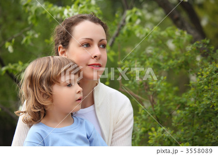 Portrait of mother with daughter in wood in summer 3558089