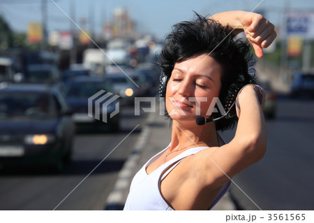 girl in headphone set on highway middle girl in headphone set on highway middle 3561565