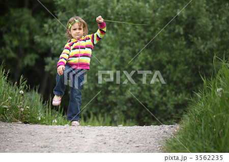 little girl makes gymnastic in park little girl makes gymnastic in park 3562235