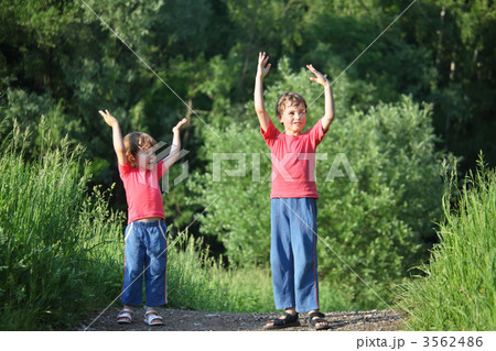 boy and girl make gymnastic in park boy and girl make gymnastic in park 3562486