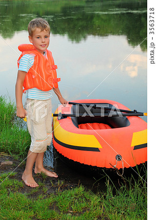 boy and inflatable boat ashore 3563718