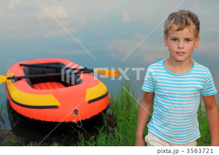 boy and inflatable boat ashore 3563721