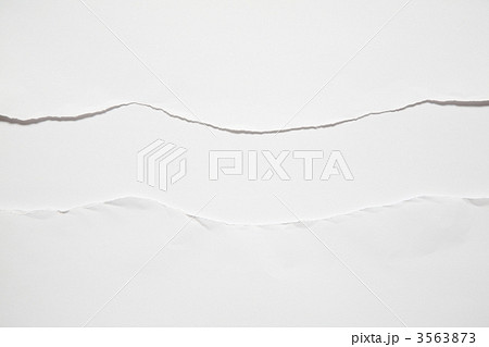 the torn sheet of paper against the white background 3563873
