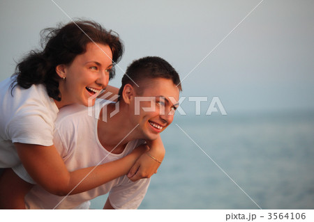 young pair embraces 3564106