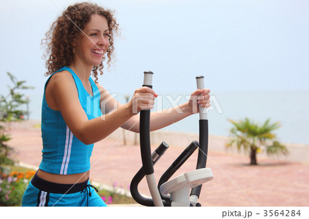smiling girl on training apparatus outdoor smiling girl on training apparatus outdoor 3564284
