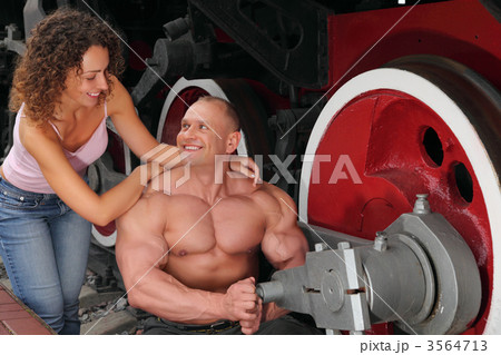 athlete, young woman and locomotive`s wheel athlete, young woman and locomotive`s wheel 3564713