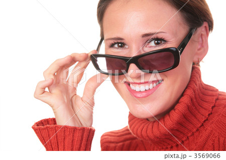 pretty woman in dark glasses and red sweater pretty woman in dark glasses and red sweater 3569066