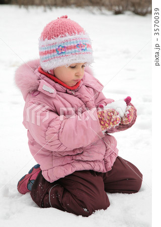 little girl play with snow in winter 3570039