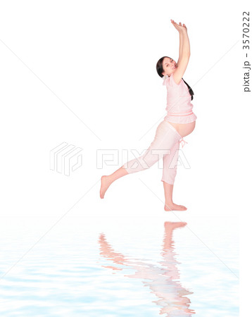 Pregnant girl doing exercise sideview Pregnant girl doing exercise sideview 3570222