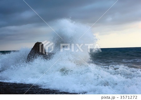 Sea coast with waves breaking about stone Sea coast with waves breaking about stone 3571272