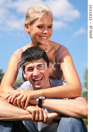 Girl embraces boy from back 3585435