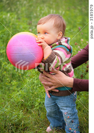 Mother hold baby with ball 3585979
