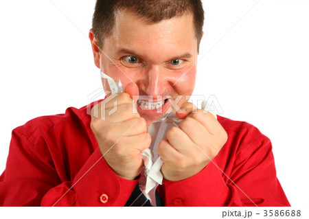 Irate man in red shirt rips sheet of paper 3586688