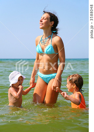 Mother and two children in sea Mother and two children in sea 3588048