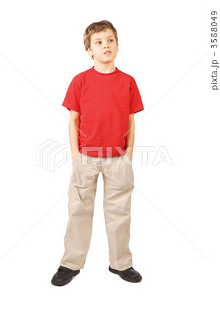 little boy in red shirt hands in pockets open mouth standing on 3588049