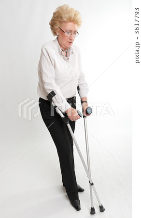 Blonde senior female with crutches 3617793