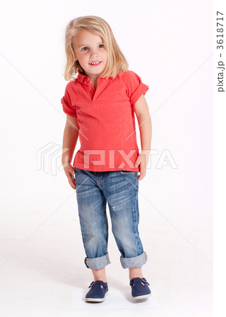 Smiling little girl in jeans and red shirt 3618717
