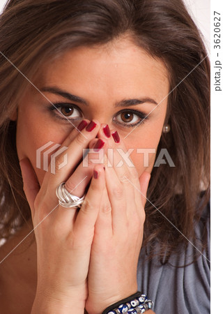 Brunette covering her face 3620627