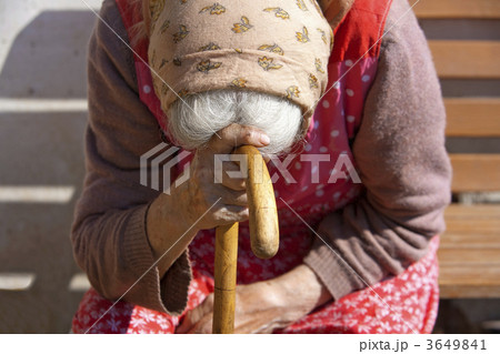 hands of an old woman with a cane 3649841