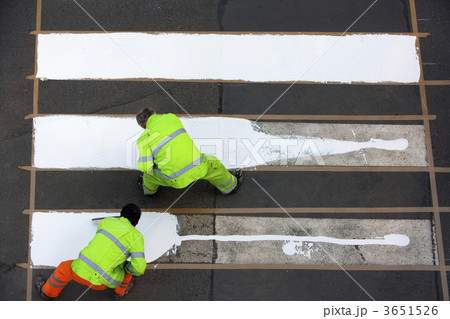 workers painting crosswalk workers painting crosswalk 3651526