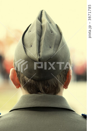 young soldier in field cap focusing point on back of the head 3671785
