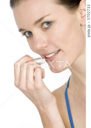 beautiful girl applying lipstick 3702733