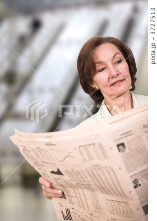 business woman reading a newspaper business woman reading a newspaper 3727513