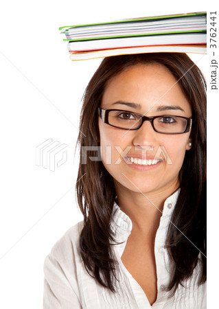 Student with notebooks on her head 3762441