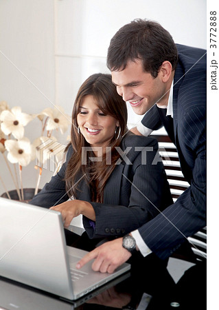 Business couple on a laptop 3772888