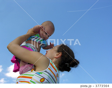 mother with baby and plane in sky 3773564