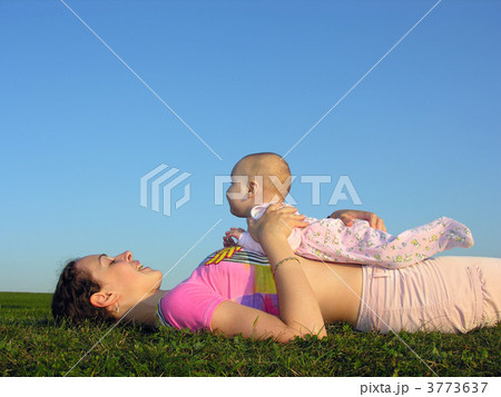 mother with baby on sunset lie from the side 2 mother with baby on sunset lie from the side 2 3773637