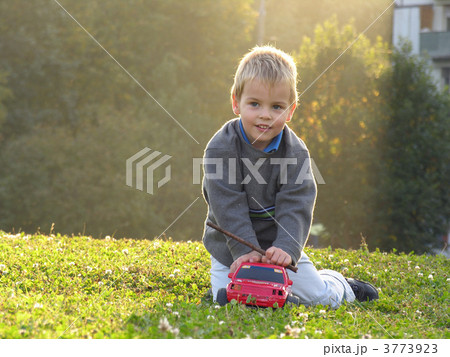 child play wth car on sunset light 3773923