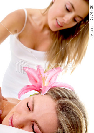 Woman having a back massage Woman having a back massage 3774500