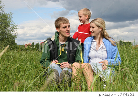 family on meadow waiting next child family on meadow waiting next child 3774553