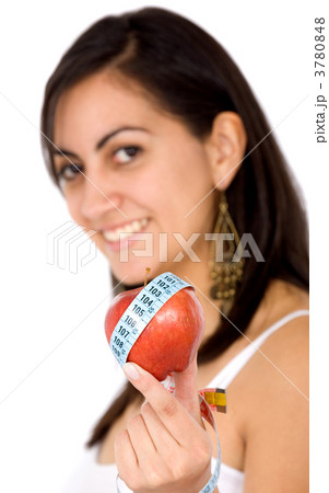 girl holding an apple smiling 3780848