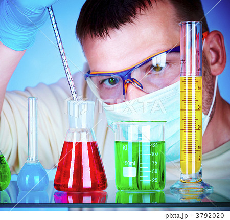 scientist in laboratory with test tubes 3792020