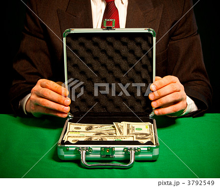 man's hand holds a suitcase with dollars 3792549