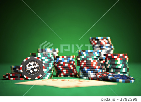 Playing cards on green cloth 3792599