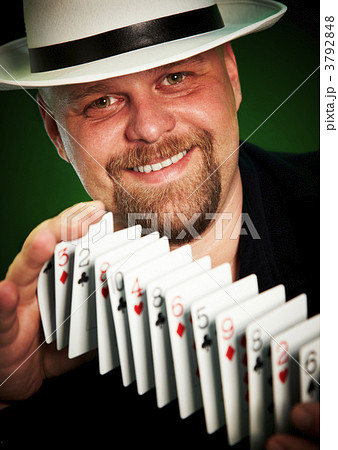 man skilfully shuffles playing cards man skilfully shuffles playing cards 3792848