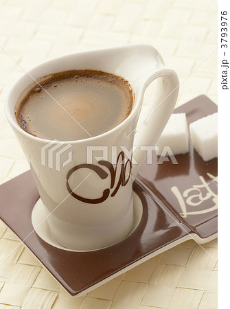 choco latte. A white cup of coffee on a support. 3793976