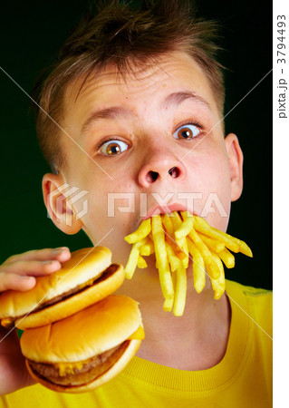child and fast food. child and fast food. 3794493