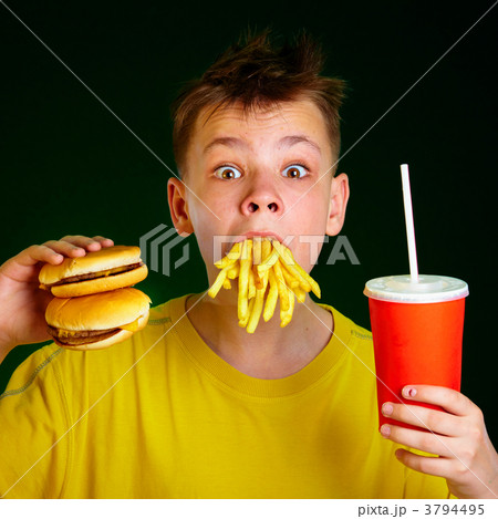 child and fast food. child and fast food. 3794495