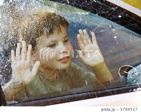 child and window on a wet rainy day 3794517