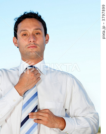 Business man fixing tie 3797899