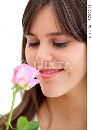 Beautiful woman smelling a flower 3799211