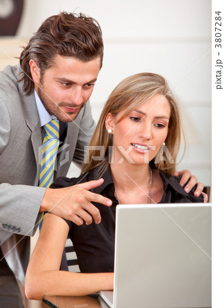 business couple on a laptop 3807284
