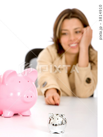 woman looking at piggybanks 3814910